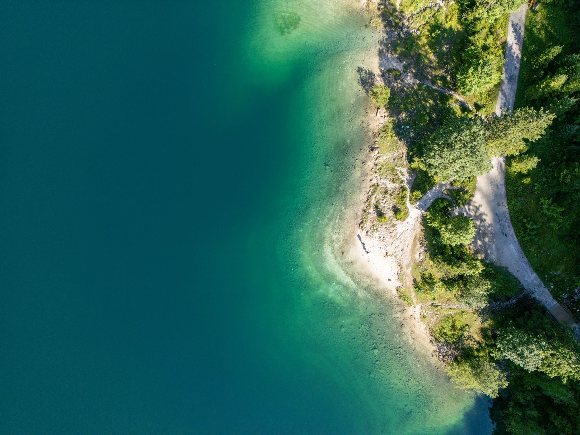 Protected shoreline and clear water representing sustainable environmental outcomes